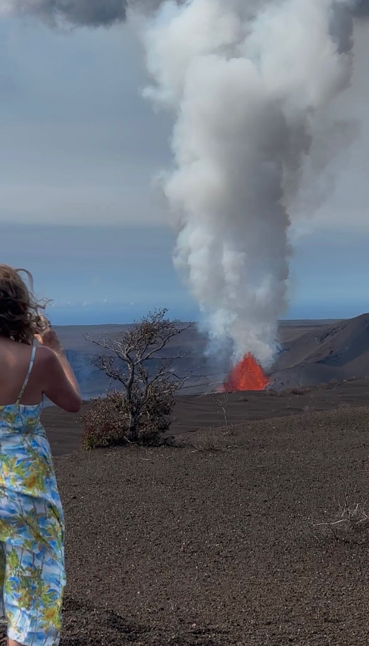 Deona watching a volcano eruption on the Big Island